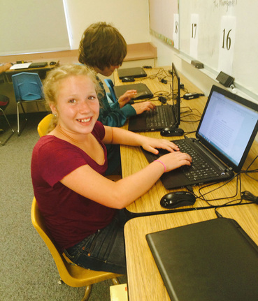 Students use computers in the elementary school lab.